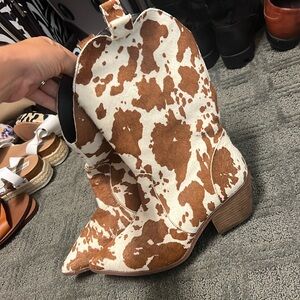 Worn one time cowhide boots